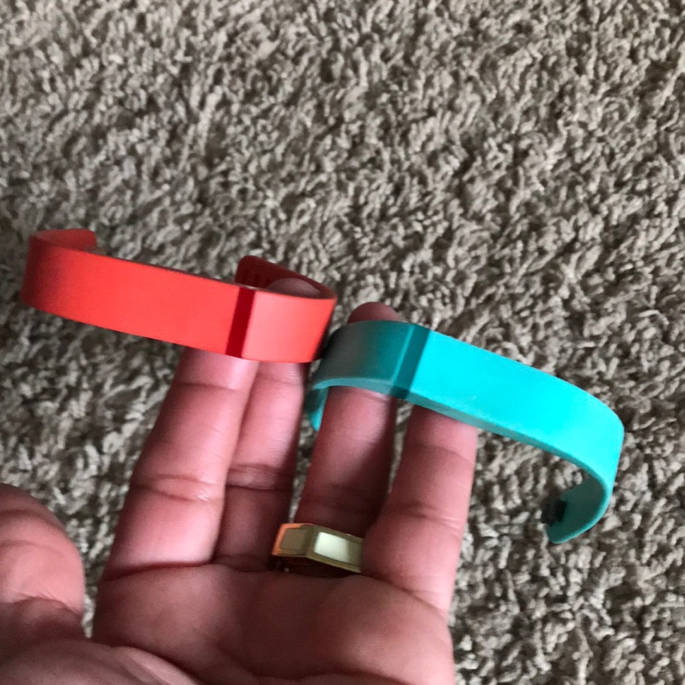 Fitbit bracelets: 2 for $20. One aqua, one orange.